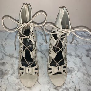 Nude, 4.5 inch, lace up heels.